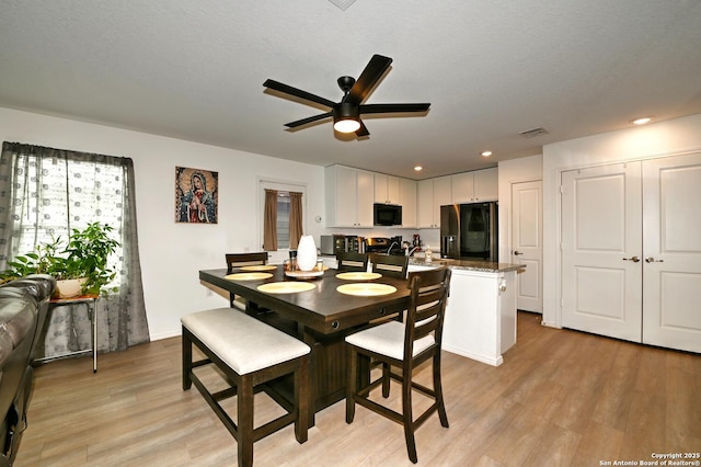 923 Cook Bnd, San Antonio, TX 78221 - dining space featuring light wood finished floors, ceiling fan, and recessed lighting