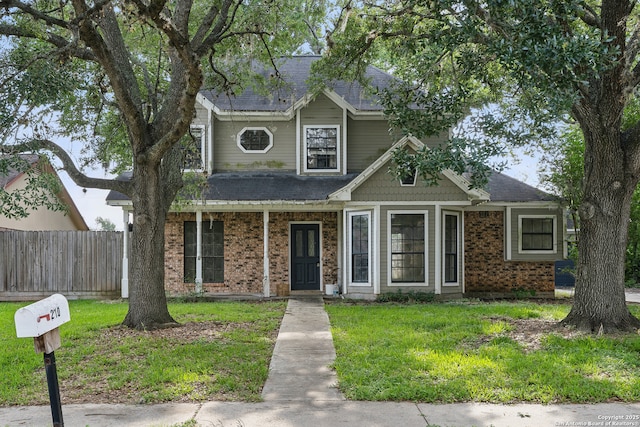 210 Daffodil St, Lake Jackson, TX 77566 - view of front of house featuring brick siding and roof with shingles