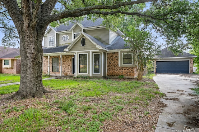 210 Daffodil St, Lake Jackson, TX 77566 - traditional-style house featuring asphalt driveway, brick siding, and a garage