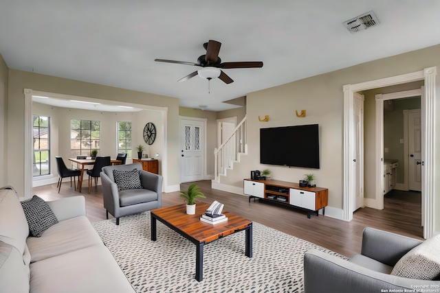 210 Daffodil St, Lake Jackson, TX 77566 - living room featuring stairway, ceiling fan, wood finished floors, and baseboards