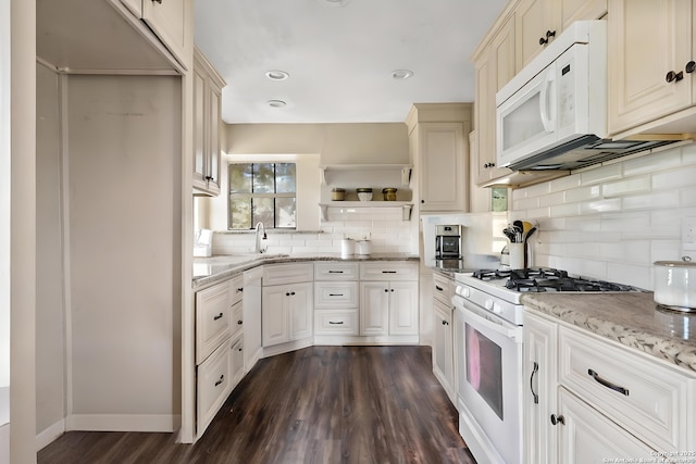 210 Daffodil St, Lake Jackson, TX 77566 - kitchen featuring white appliances, open shelves, dark wood-style flooring, decorative backsplash, and light stone countertops