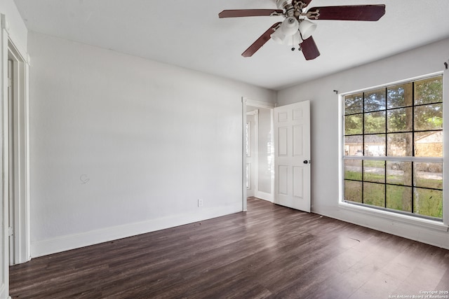 210 Daffodil St, Lake Jackson, TX 77566 - unfurnished bedroom featuring dark wood finished floors, baseboards, and ceiling fan