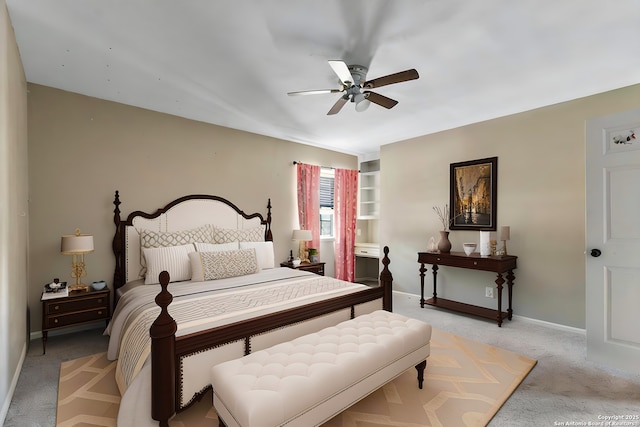 210 Daffodil St, Lake Jackson, TX 77566 - bedroom with light carpet, baseboards, and a ceiling fan