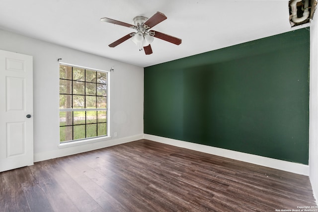 210 Daffodil St, Lake Jackson, TX 77566 - empty room with wood finished floors, baseboards, and ceiling fan