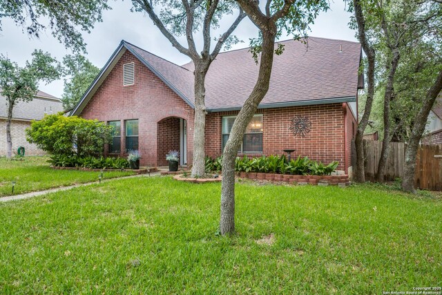 9618 Alderwood, San Antonio, TX 78250 - tudor-style house featuring brick siding and roof with shingles