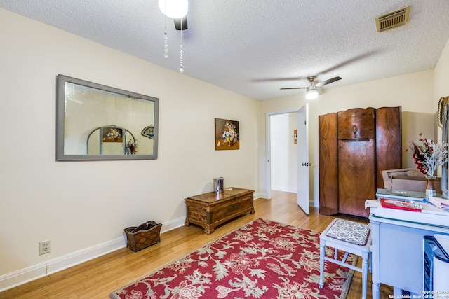 9618 Alderwood, San Antonio, TX 78250 - home office featuring ceiling fan, wood finished floors, a textured ceiling, and baseboards