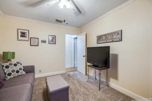 9618 Alderwood, San Antonio, TX 78250 - living area with a textured ceiling, a ceiling fan, carpet flooring, crown molding, and baseboards