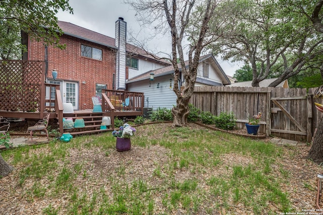 9618 Alderwood, San Antonio, TX 78250 - back of property featuring brick siding, a chimney, and a deck