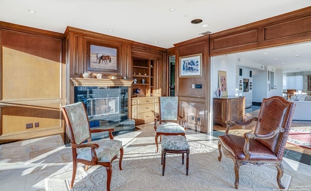 7887 Broadway Unit 1102, San Antonio, TX 78209 - living area featuring built in features, a fireplace, recessed lighting, and wood walls