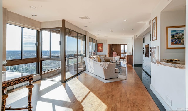 7887 Broadway Unit 1102, San Antonio, TX 78209 - living area featuring light wood-type flooring and recessed lighting
