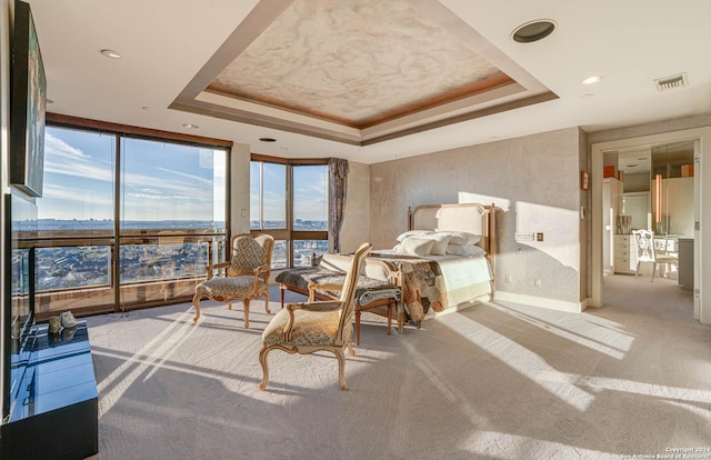 7887 Broadway Unit 1102, San Antonio, TX 78209 - carpeted bedroom with expansive windows, a tray ceiling, access to outside, recessed lighting, and baseboards