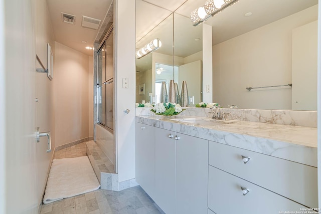7887 Broadway Unit 1102, San Antonio, TX 78209 - bathroom featuring enclosed tub / shower combo and vanity