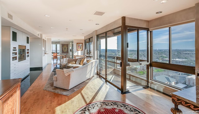 7887 Broadway Unit 1102, San Antonio, TX 78209 - living area with wood finished floors and healthy amount of natural light
