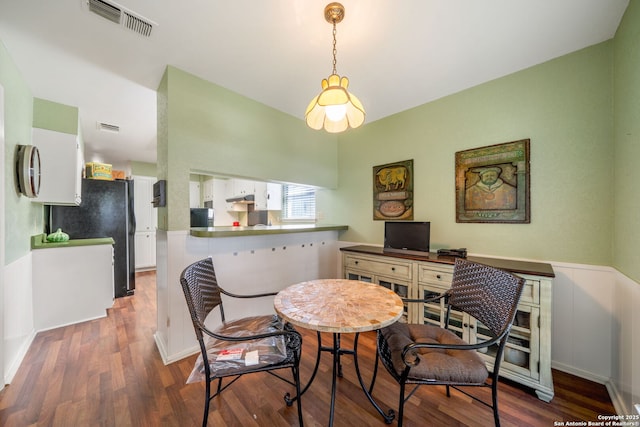 424 Fenwick Dr, Windcrest, TX 78239 - dining room with wood finished floors and wainscoting