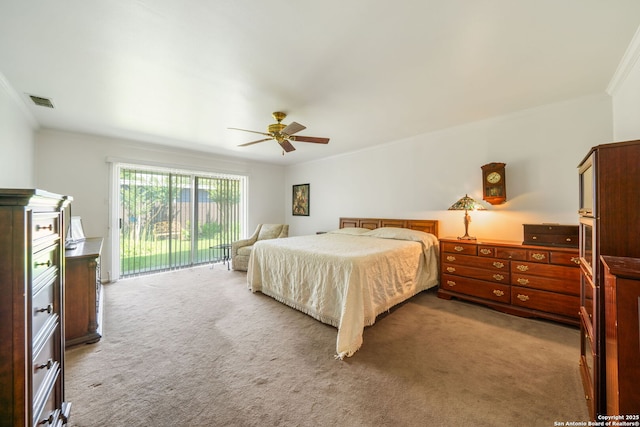 424 Fenwick Dr, Windcrest, TX 78239 - carpeted bedroom with access to outside, ornamental molding, and ceiling fan