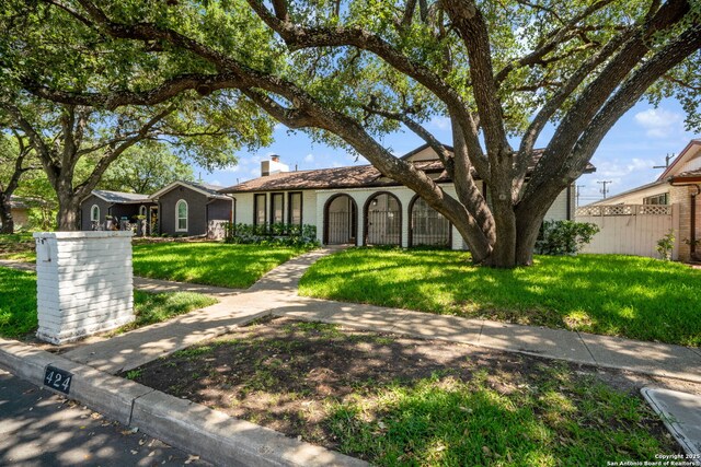 424 Fenwick Dr, Windcrest, TX 78239 - view of front of house with a chimney and brick siding