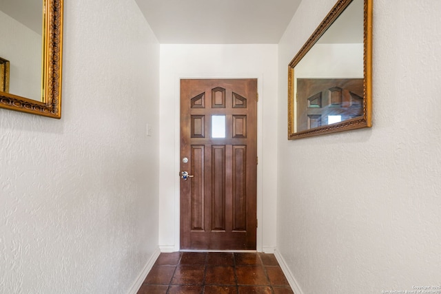 424 Fenwick Dr, Windcrest, TX 78239 - doorway with baseboards and dark tile patterned flooring