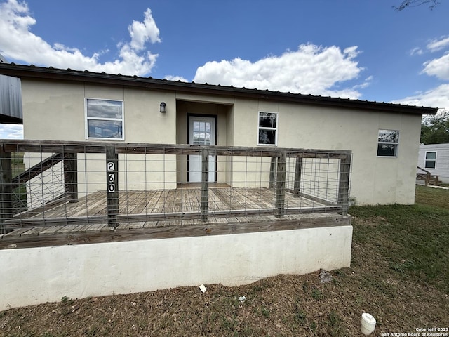13338 Interstate 35, Moore, TX 78057 - back of property with stucco siding and metal roof