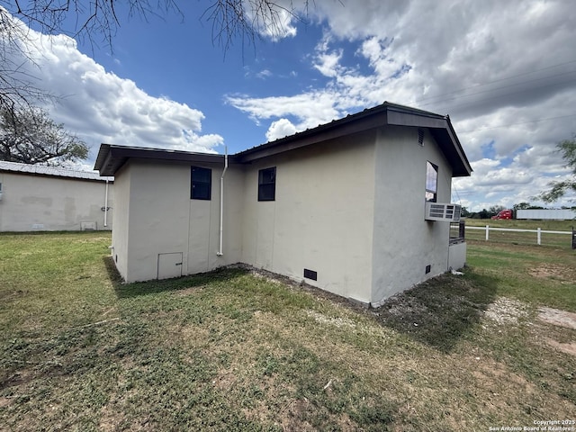 13338 Interstate 35, Moore, TX 78057 - view of side of property with stucco siding and crawl space
