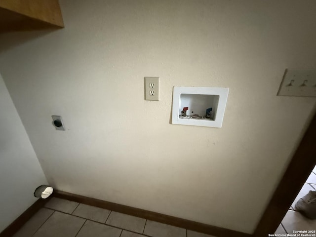 13338 Interstate 35, Moore, TX 78057 - washroom featuring hookup for an electric dryer, tile patterned floors, hookup for a washing machine, and baseboards