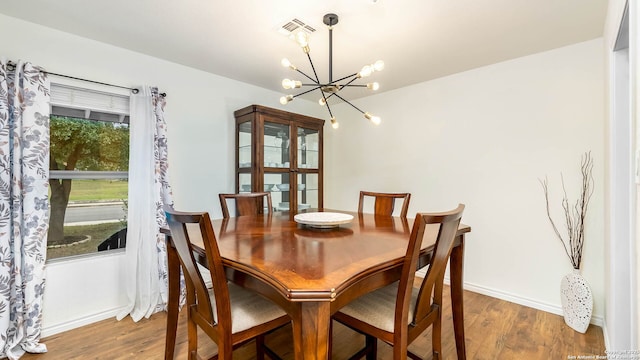 511 Serenade, San Antonio, TX 78216 - dining area featuring a chandelier, wood finished floors, and baseboards