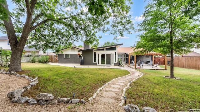 511 Serenade, San Antonio, TX 78216 - rear view of house with a chimney, a patio, and brick siding