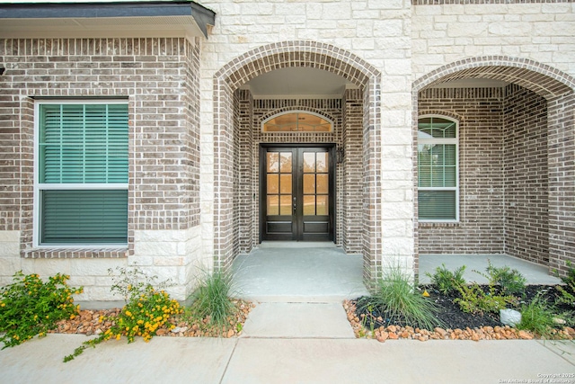 557 Poe Pkwy, Castroville, TX 78009 - entrance to property featuring french doors and brick siding