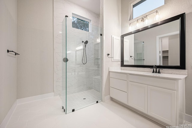 557 Poe Pkwy, Castroville, TX 78009 - bathroom featuring plenty of natural light, a marble finish shower, vanity, and tile patterned floors