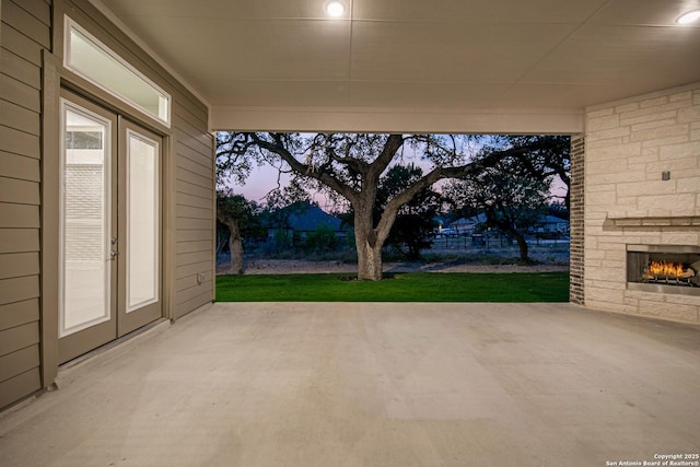557 Poe Pkwy, Castroville, TX 78009 - view of patio featuring an outdoor stone fireplace