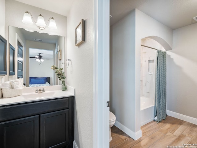 126 Stout Cv, Cibolo, TX 78108 - ensuite bathroom with wood finished floors, toilet, a ceiling fan, and baseboards