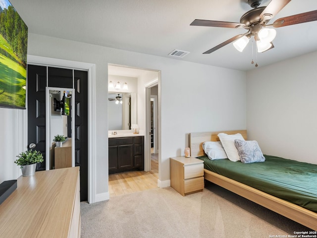 126 Stout Cv, Cibolo, TX 78108 - bedroom with light carpet, a closet, ceiling fan, connected bathroom, and baseboards