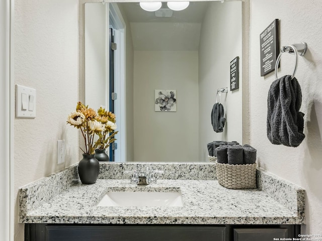 126 Stout Cv, Cibolo, TX 78108 - bathroom with vanity and a textured wall