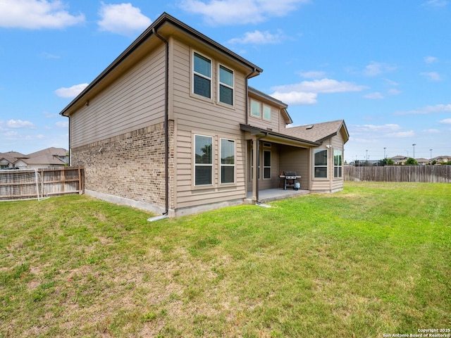 126 Stout Cv, Cibolo, TX 78108 - rear view of property featuring a patio and brick siding
