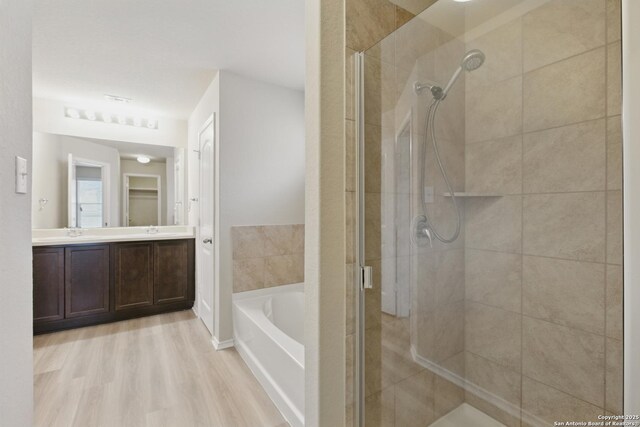 15206 Field Sparrow, San Antonio, TX 78253 - full bath with a shower stall, a garden tub, double vanity, and wood finished floors