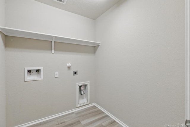 15206 Field Sparrow, San Antonio, TX 78253 - washroom with hookup for an electric dryer, light wood finished floors, washer hookup, baseboards, and gas dryer hookup