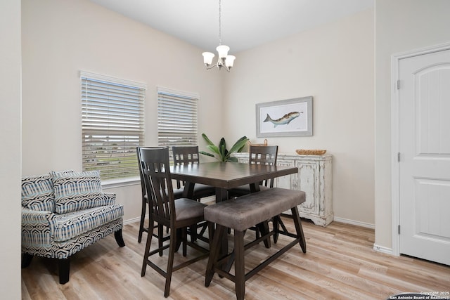 111 Great Chagos, Rockport, TX 78382 - dining room featuring a chandelier, light wood finished floors, and baseboards