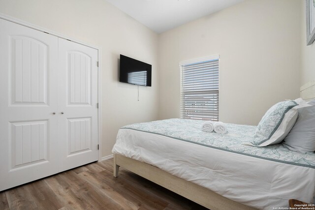 111 Great Chagos, Rockport, TX 78382 - bedroom with wood finished floors and a closet