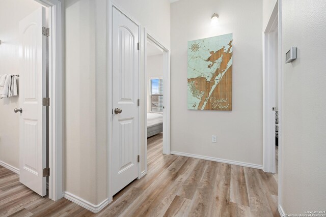 111 Great Chagos, Rockport, TX 78382 - hallway featuring light wood finished floors and baseboards