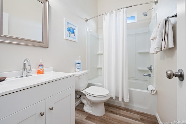 111 Great Chagos, Rockport, TX 78382 - bathroom featuring wood finished floors, shower / bath combo with shower curtain, toilet, and vanity