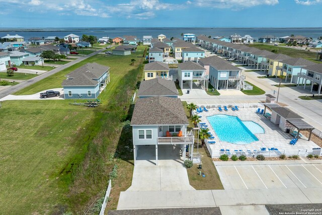 111 Great Chagos, Rockport, TX 78382 - aerial view of residential area with a pool area and a large body of water