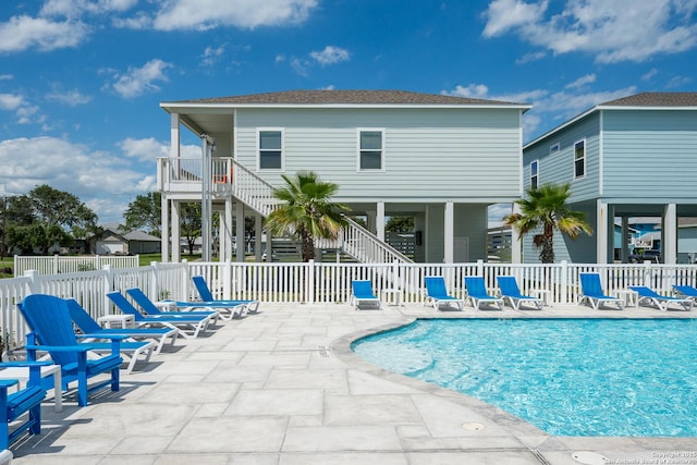 111 Great Chagos, Rockport, TX 78382 - community pool featuring a patio area, stairway, and a fenced backyard