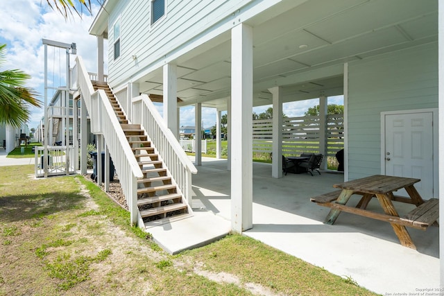 111 Great Chagos, Rockport, TX 78382 - view of patio / terrace featuring stairs