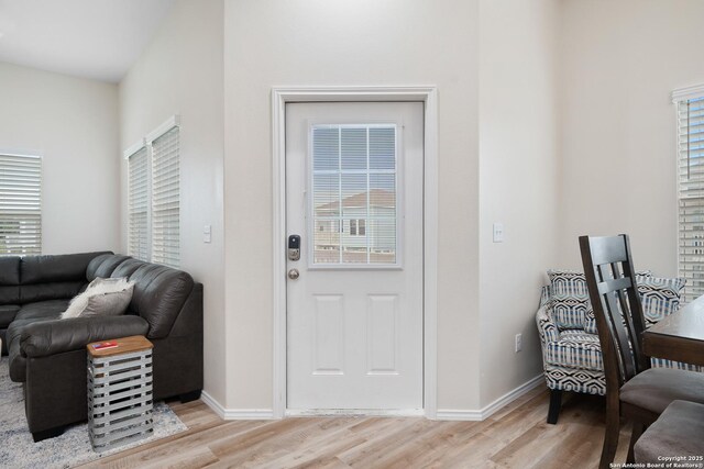 111 Great Chagos, Rockport, TX 78382 - entryway with light wood finished floors and baseboards