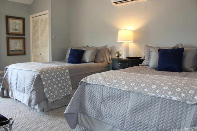 104 Horseshoe Bay Unit 5, Horseshoe Bay, TX 78657 - carpeted bedroom with a closet and a wall mounted air conditioner