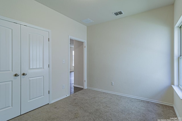 2733 Barkey Spg, San Antonio, TX 78245 - unfurnished bedroom featuring carpet, baseboards, and a closet