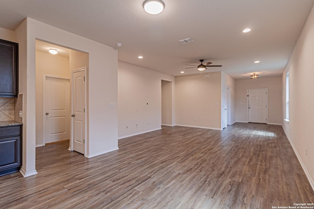 2733 Barkey Spg, San Antonio, TX 78245 - unfurnished living room with wood finished floors, a ceiling fan, baseboards, and recessed lighting