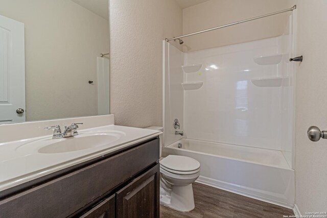 2733 Barkey Spg, San Antonio, TX 78245 - full bath with wood finished floors, toilet, vanity, and bathtub / shower combination