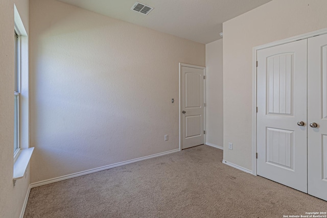 2733 Barkey Spg, San Antonio, TX 78245 - unfurnished bedroom with carpet flooring, a closet, and baseboards