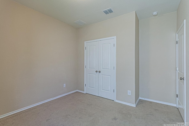 2733 Barkey Spg, San Antonio, TX 78245 - unfurnished bedroom featuring carpet floors, a closet, and baseboards