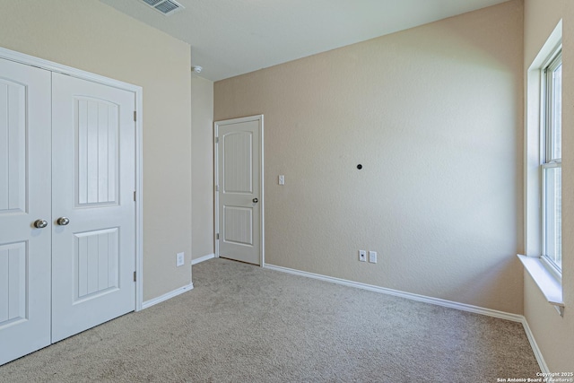 2733 Barkey Spg, San Antonio, TX 78245 - unfurnished bedroom with carpet, multiple windows, and baseboards